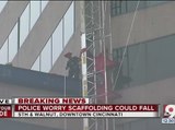 Window-washing platform dangles sideways off US Bank building in downtown Cincinnati