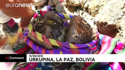 Bolivia: Believers of the Virgin of Urkupina break rocks to ask for favours during a religious procession