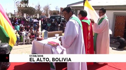 Bolivia: A priest blesses animals with holy water