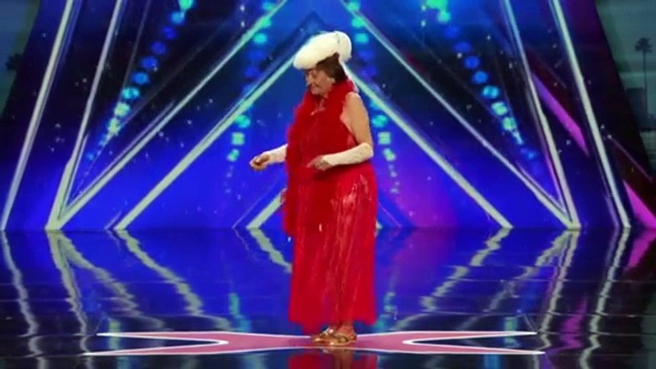 90 year old woman does a striptease on stage. You'll never guess what happens when you take off the bodice