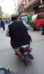 Sheikh Rasheed on Bike