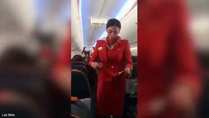 Flight attendants in the crowd cheer Football Club, Russia's Aeroflot's safety demonstration