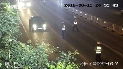 Driver arrested after knocking traffic police officer over