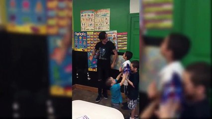 Drake Bell playing with some kids at the Kinder Garden