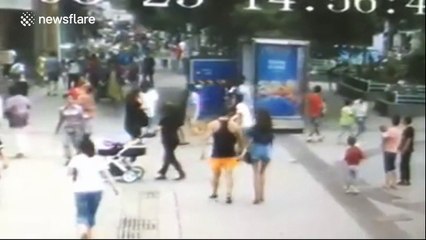 Sinkhole opens on street and injures two in China