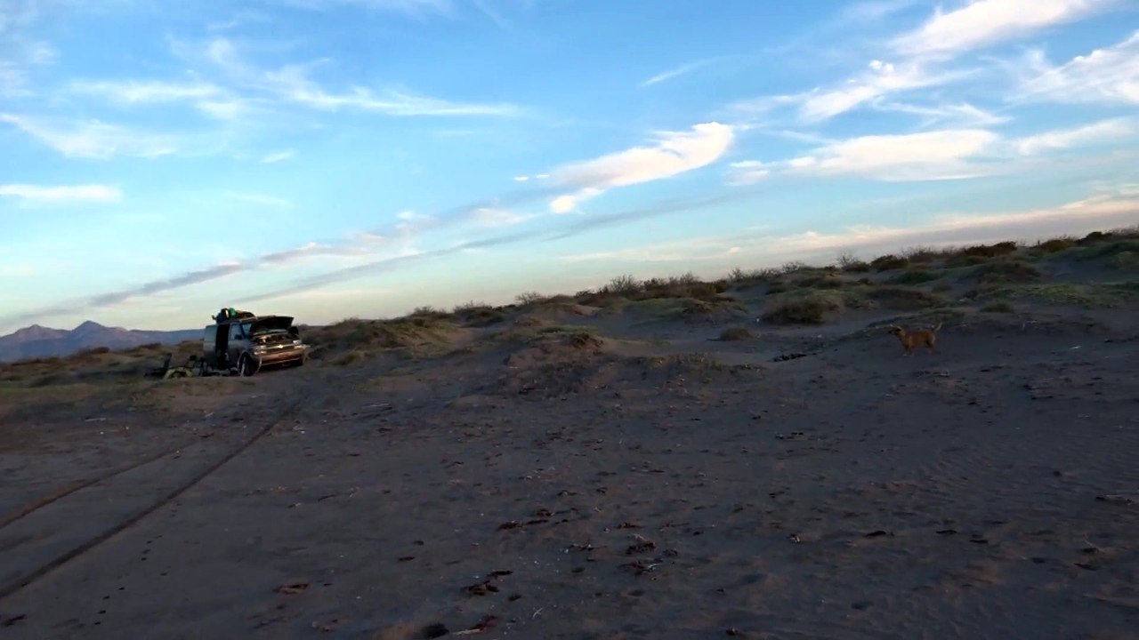 Riding XR 400 down beach in Baja
