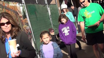 Homeless man gives out money