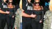 Amber Rose squeezes her assets for a busty display