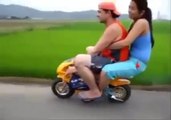 Couple Riding on Mini Bike