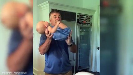 Alec Baldwin uses his son Rafa as a workout on Instagram