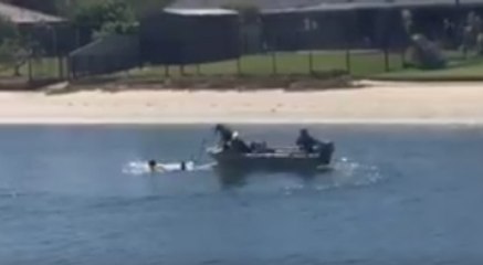 'Armed' Suspect Flees Scene by Swimming Away, Police Pull Him to Shore