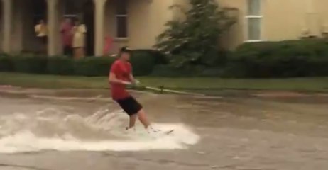 Student Wakeboards in Flooded Street at Texas Tech