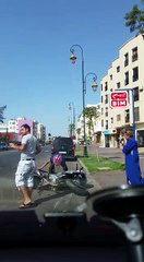 Motorcycle Sideswipes Parked Car