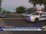 Police: Man tries to back into woman and child after argument, gets shot