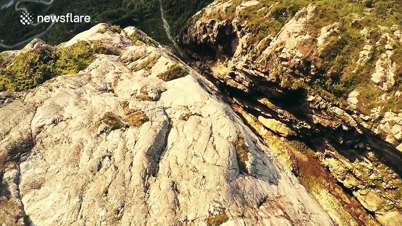 Stunning wingsuit flight down Norwegian fjord