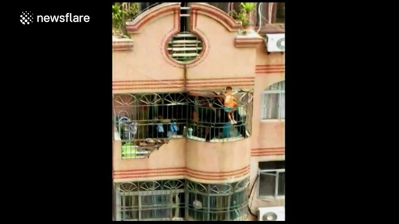 Firefighters rescue boy stuck in security net on seventh floor