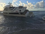 Yacht washes up on Palm Beach near the Palm Beach Inlet