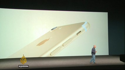 Apple unveils new iPhone as it faces challenges