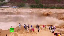 Mesmerizing force of nature_ Chinese waterfall in spectacular rage after rainfall (Aerial footage)