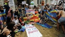 Burkini ban protesters stage beach party outside French embassy