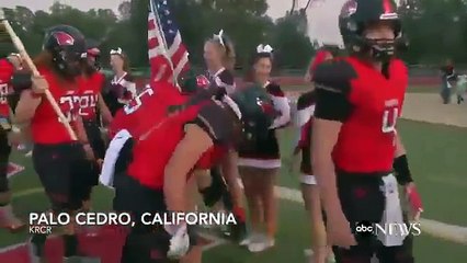 Cheerleader battling cancer brought to tears by football team's moving gesture