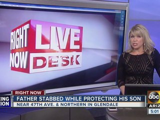 Father stabbed while protecting his son