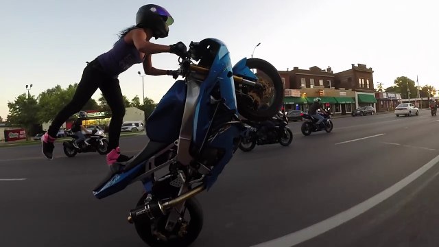 Crazy motorcycle stunts by a hot Girl on St. Louis streets