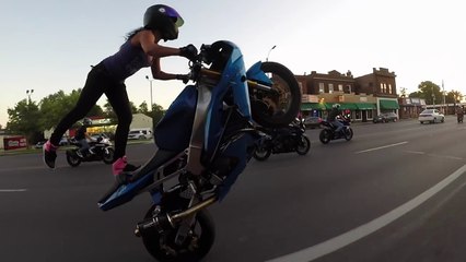 Crazy motorcycle stunts by a hot Girl on St. Louis streets