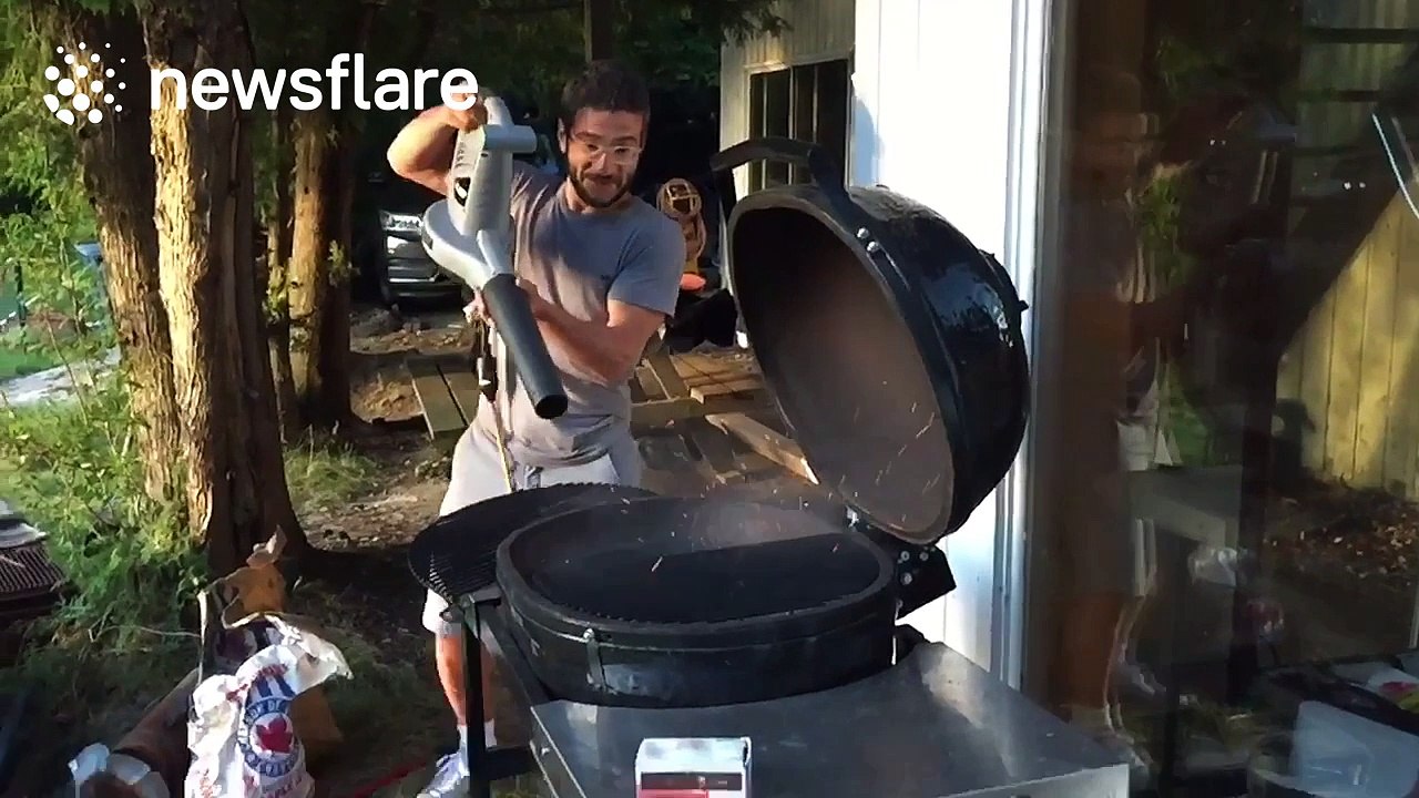 Stoking BBQ flames using a leaf blower