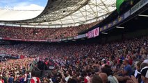 Dutch football fans throw teddies towards patients at local children's hospital