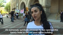 Demonstrators protest in front of new Trump Hotel in Washington