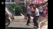 Two kung-fu martial artists 'fight' on Chinese street