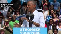 Obama makes solo campaign debut at Clinton rally