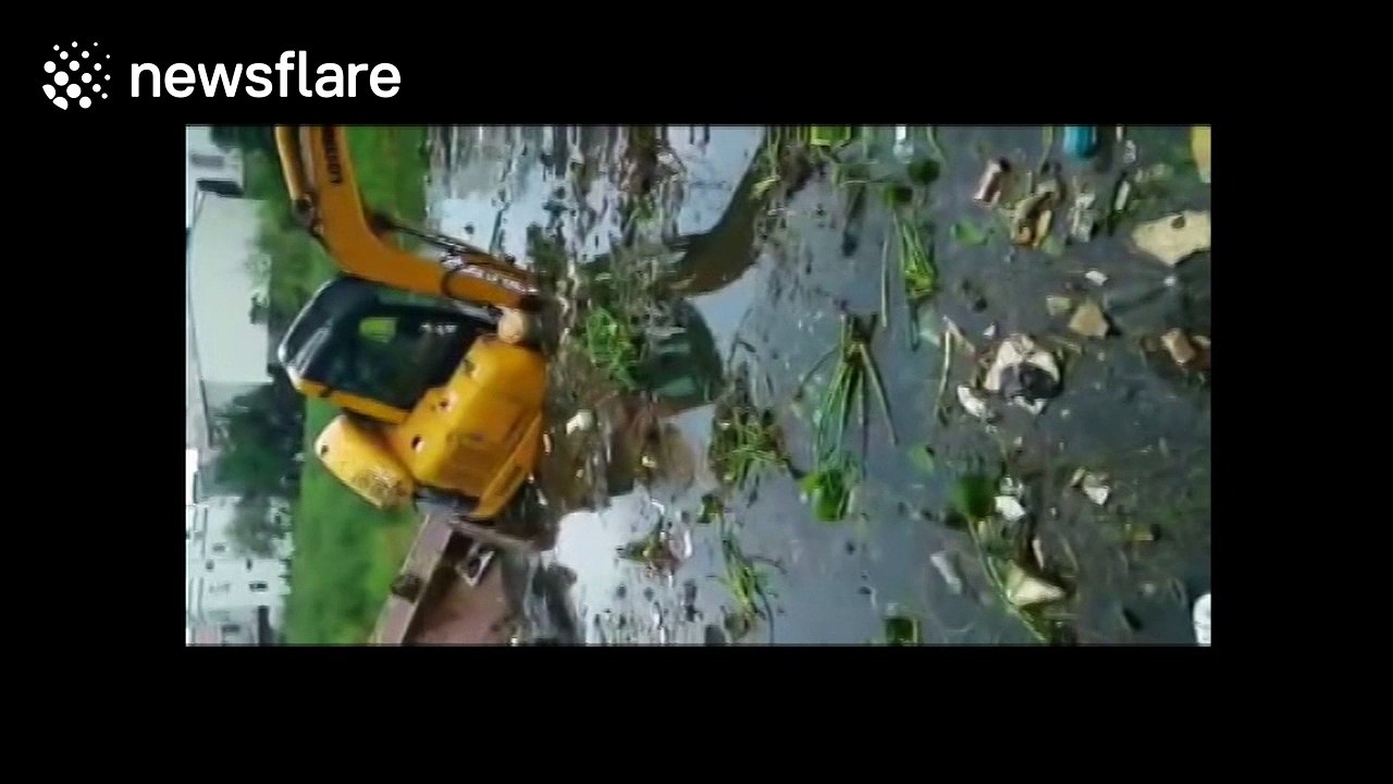 Digger falls into pond, driver lucky to escape