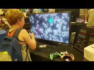 Little Boy Joyously Plays Video Game