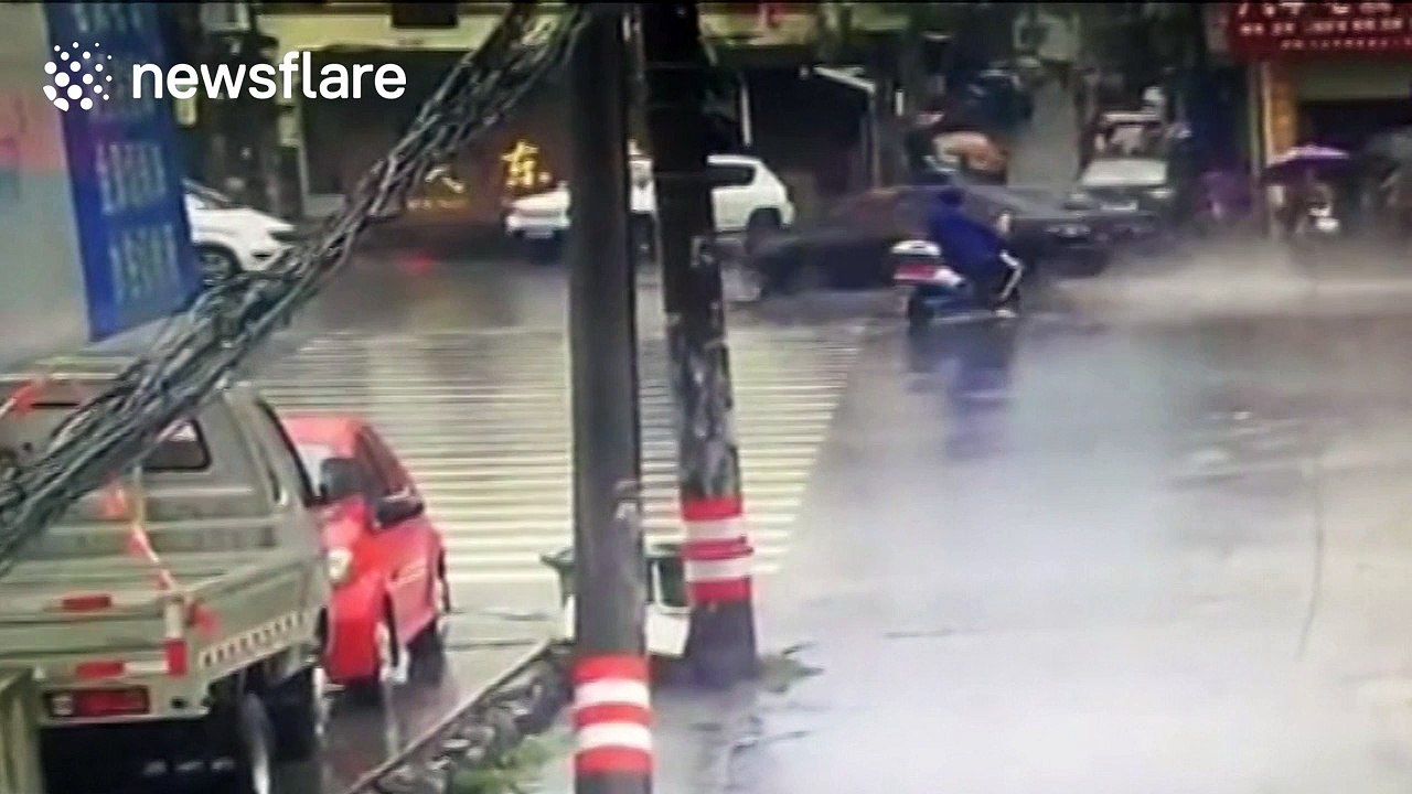Woman crossing road on scooter narrowly escapes being killed by lorry