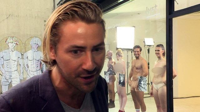 Spencer Matthews stands in a shop window in his underwear