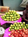 one fruit seller is selling different types of fruit