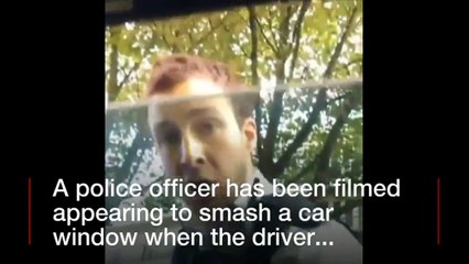 London Met Police attacking a car