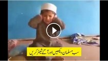 Small Child reciting Quran Majeed