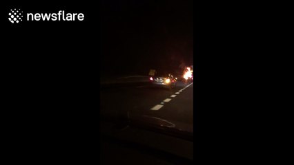 Close-up footage of crane on fire after explosion on the M40 last night