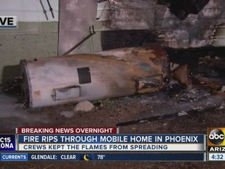 Fire rips through mobile home in Phoenix