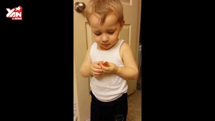 Baby say goodbye to a goldfish