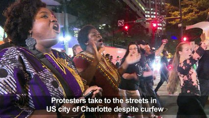 Protesters remain on Charlotte streets, defying midnight curfew
