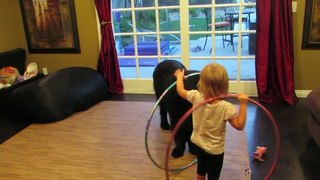 Cute Toddler Teaches Dog To Hula Hoop