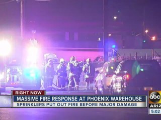 Massive firefighter response keeps warehouse blaze from spreading