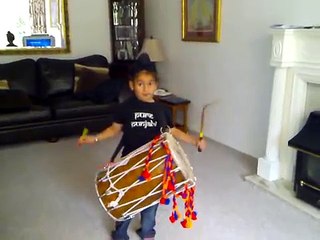 7 year old  boy playing dhol