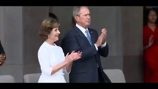 FLOTUS Michelle Obama gives Former Pres George W. Bush a hug