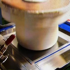 Watching how this bowl is painted.