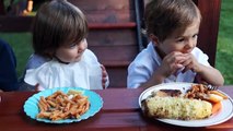 Cute Girl Helps Boy Keep Clean During BBQ